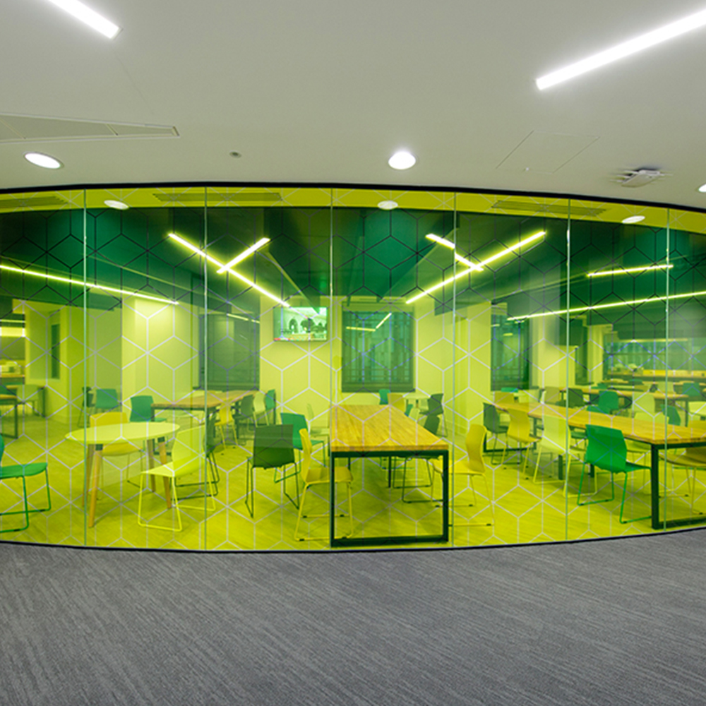 Office refurbishment with unique curved glass walls and colourful furniture.